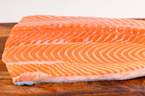 Fresh salmon fillet on a wooden board
