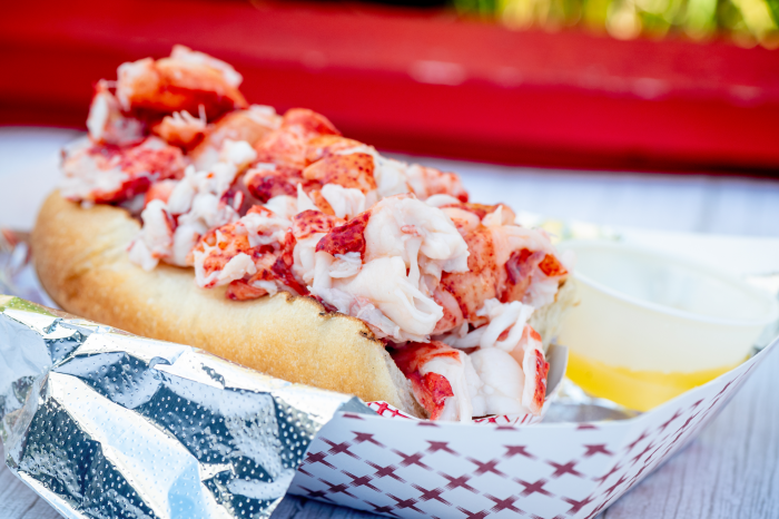 Fresh lobster roll served in a toasted bun with melted butter